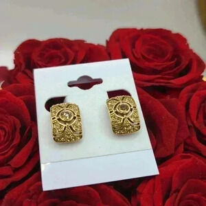 Vintage Monet gold tone amber rhinestone clip on earrings